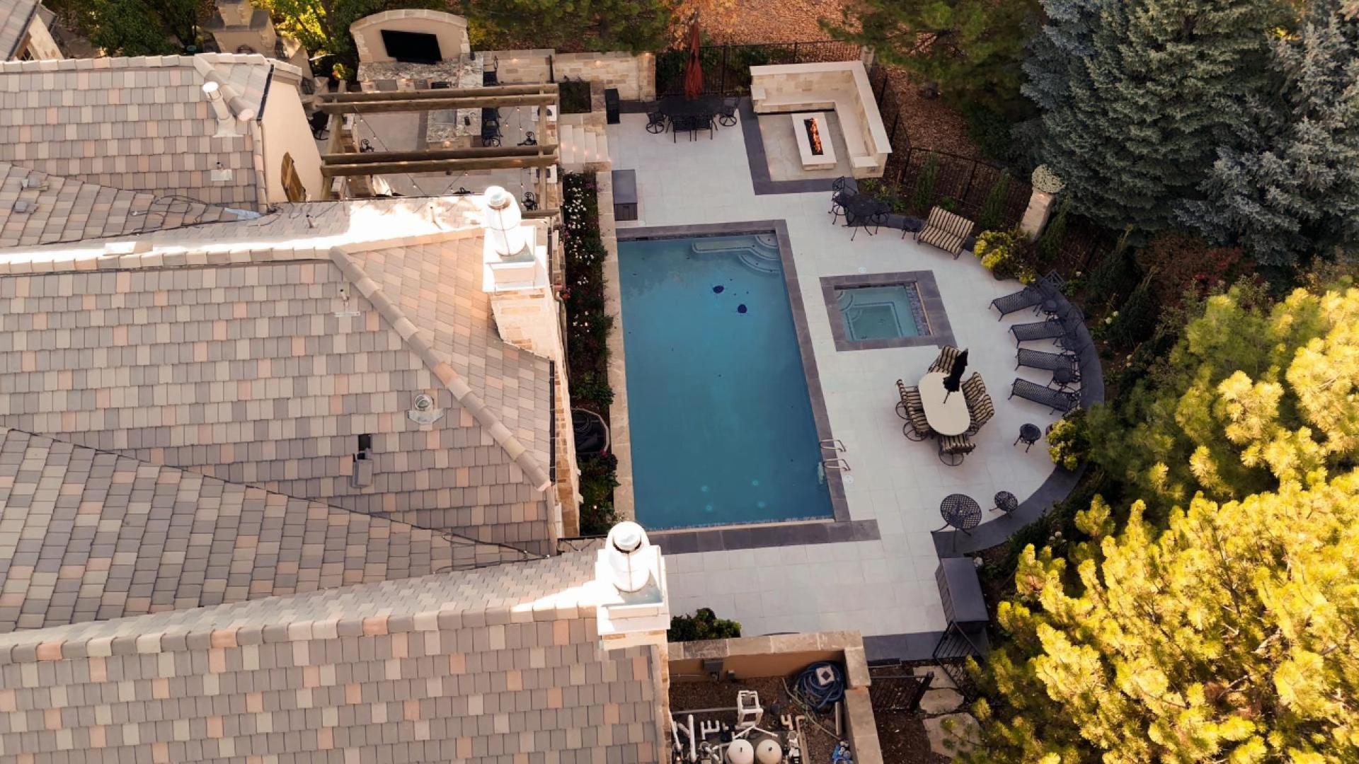 Drone photo of a luxury home with a pool